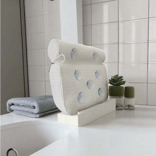White bathtub pillow with 7 suction cups on a breathable 3d mesh material.