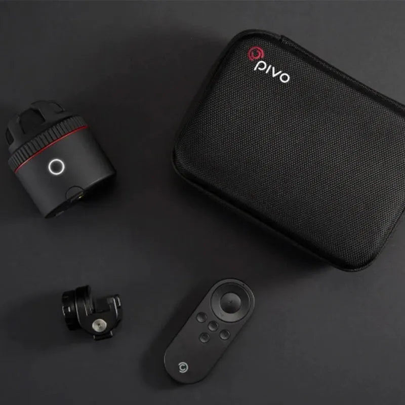 Matte black PIVO facial tracking camera mounted with a smartphone, showing its 360-degree rotating base.