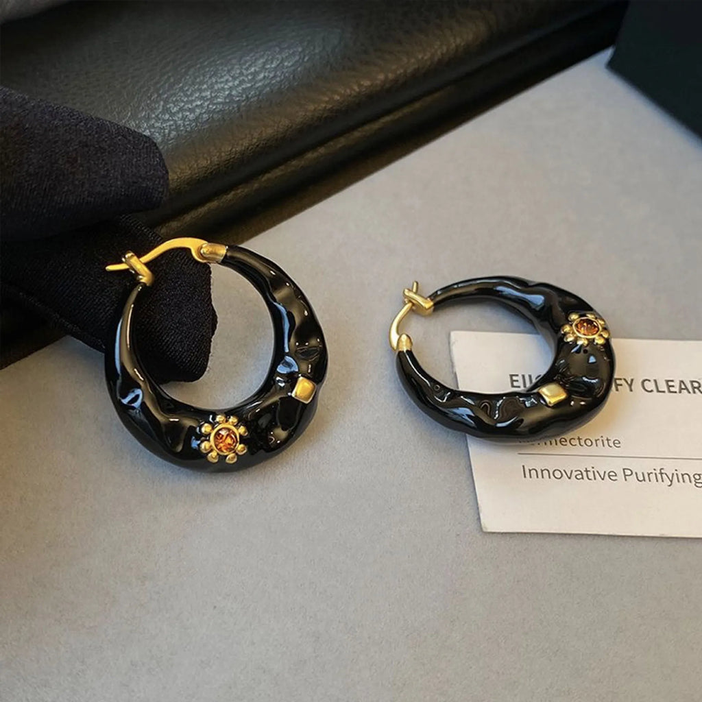 Hong Kong style retro ear studs with dripping oil finish and rhinestone detail in black and red colours