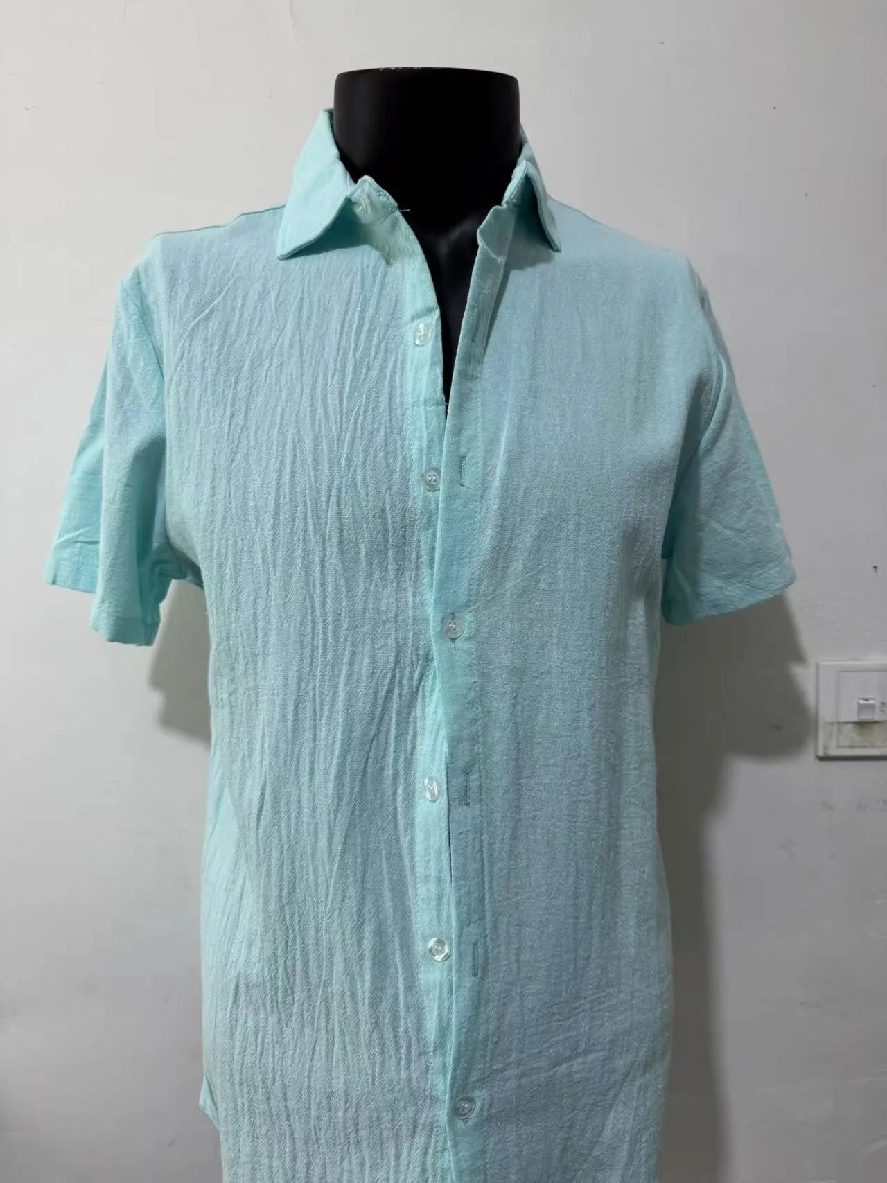 Men's loose fit short sleeve linen shirt in a cotton and linen blend, shown in apricot colour.