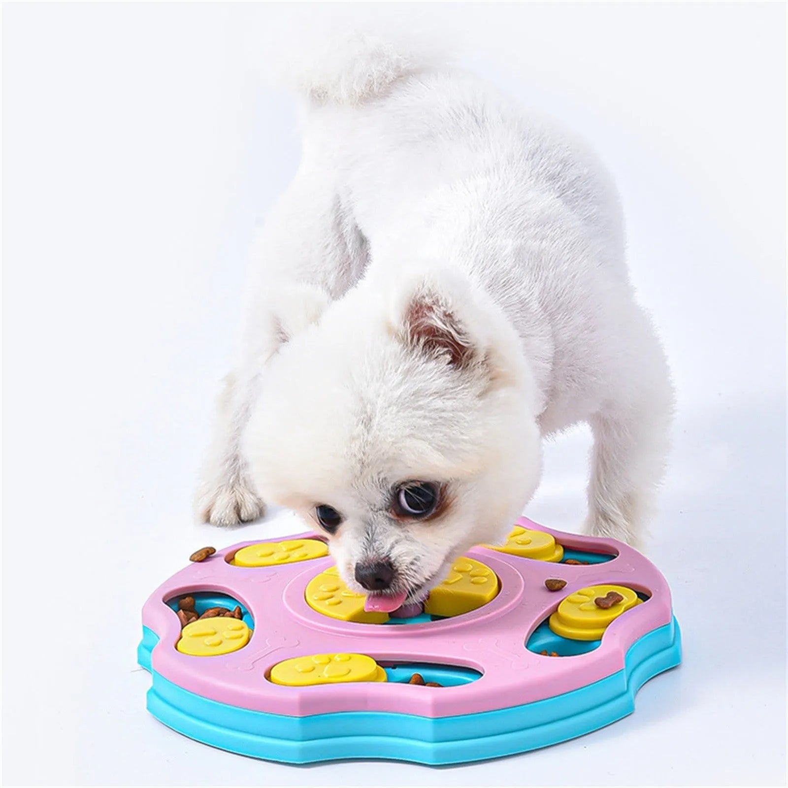 Blue and pink dog puzzle feeder toy with multiple compartments for interactive food searching gameplay