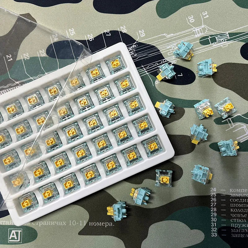 36 Tiger Mo Sea Salt Lemon PRO Mute linear silent mechanical keyboard switches arranged in a grid.