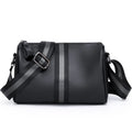 Black genuine leather one-shoulder crossbody bag showing its large capacity and crossbody strap.