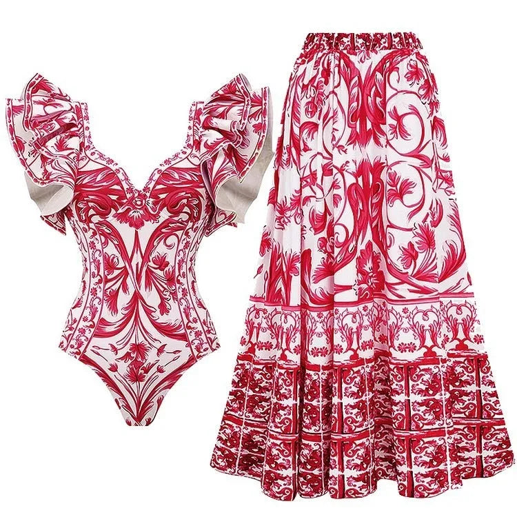 Adult woman modelling a printed one-piece swimsuit in a choice of colours including rose pink, blue, white, and a red apron set style.