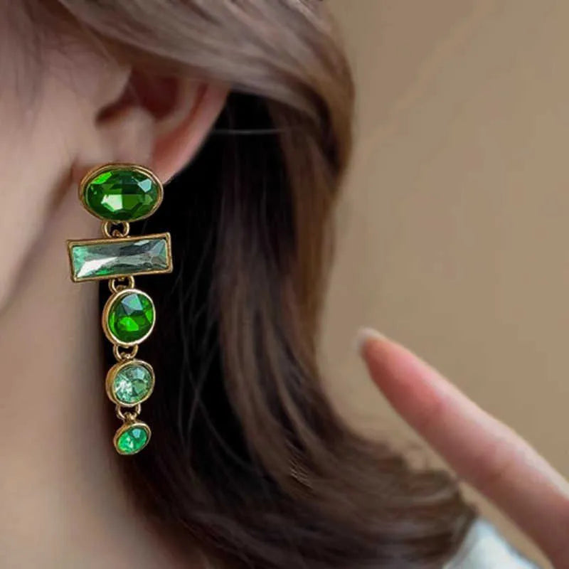 A pair of green gradient geometric drop earrings with alloy construction and inlaid zircon stones.