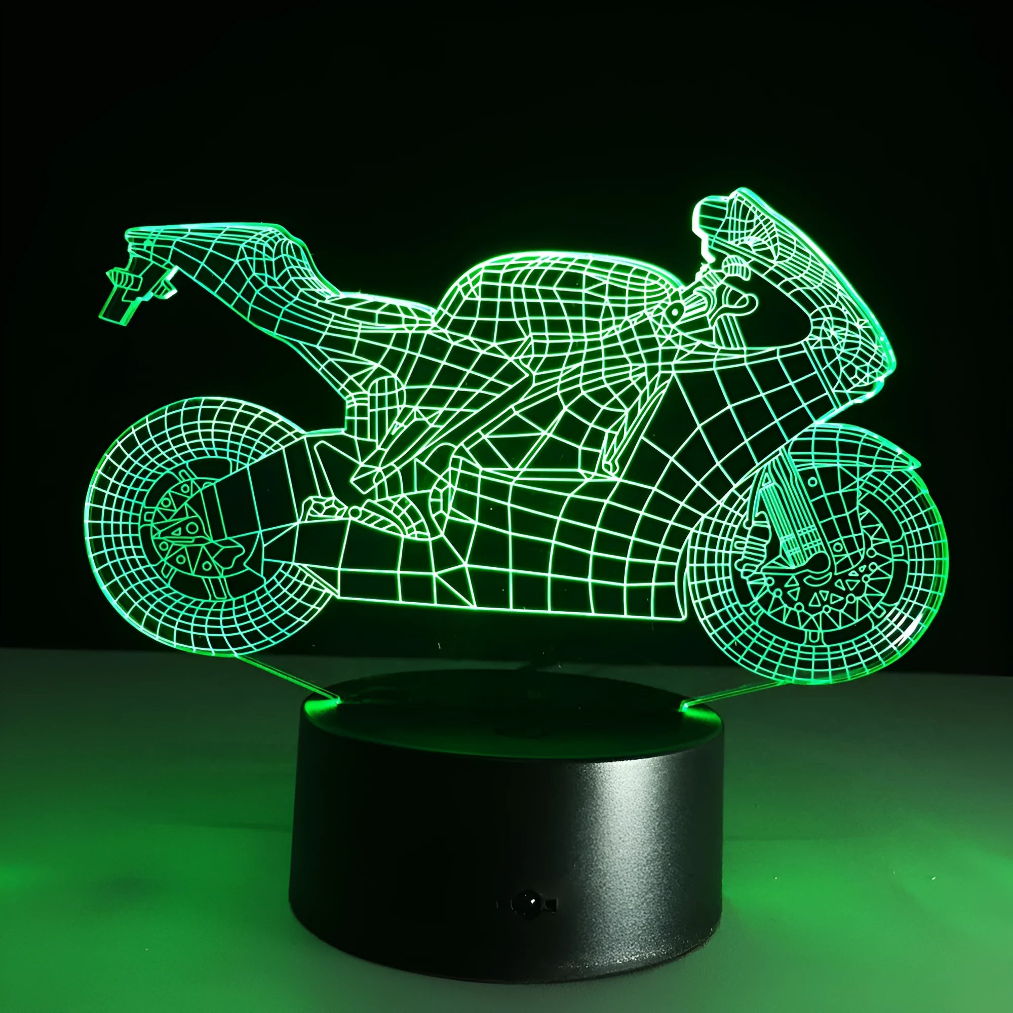 Motorcycle LED desk lamp with black base and acrylic shade showing orange colour