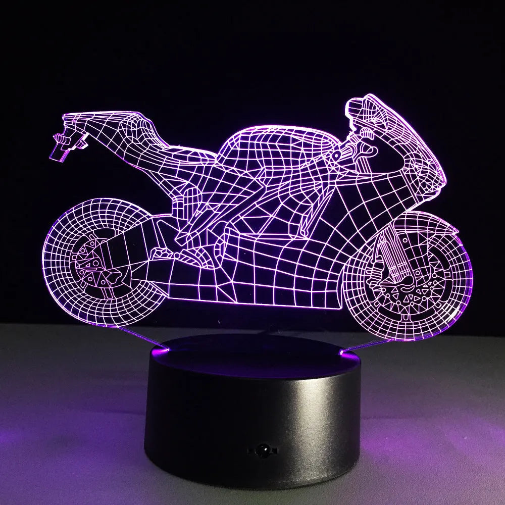 Motorcycle LED desk lamp with black base and acrylic shade showing orange colour