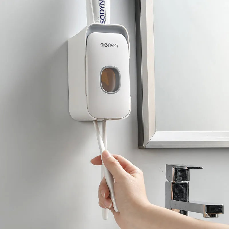 Wall-mounted automatic toothpaste dispenser in blue colour with touch sensor.