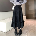 Korean style corduroy A-line midi skirt with an elastic waistband in a solid colour.
