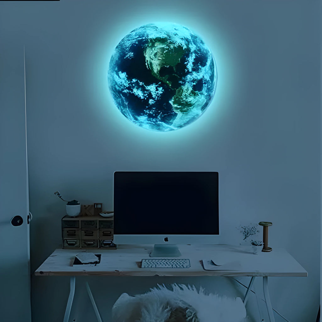 Glow in the dark 3D Earth planet wall sticker in three size options on a dark background