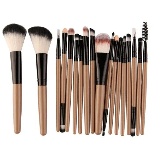 MAANGE 18-piece makeup brush set with fan-shaped cosmetic tools laid out on a table.