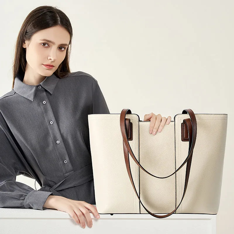 Women's black genuine leather crossbody bag showing internal compartments and horizontal square shape