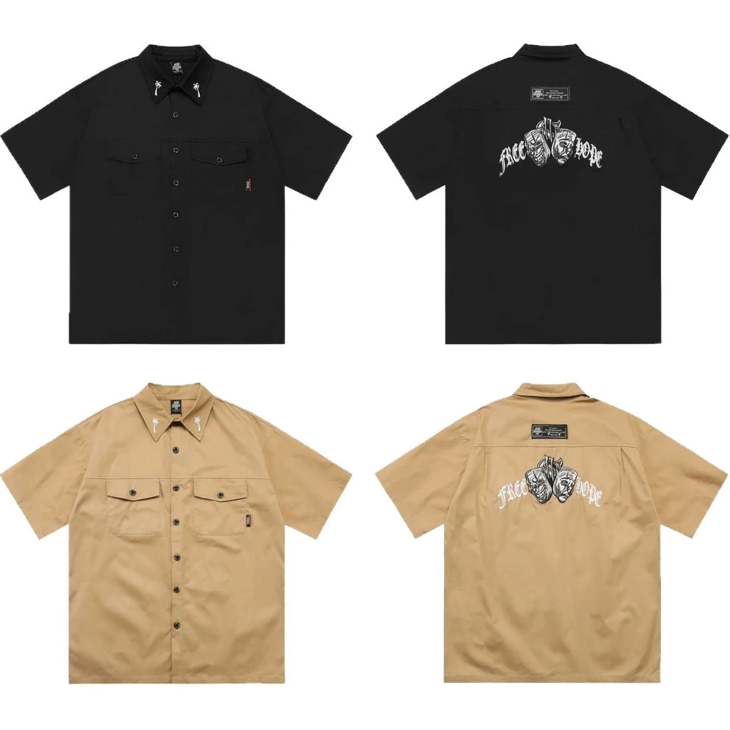 Men's black loose fit cotton blend pocket shirt with half sleeves and embroidered detail on a hanger.