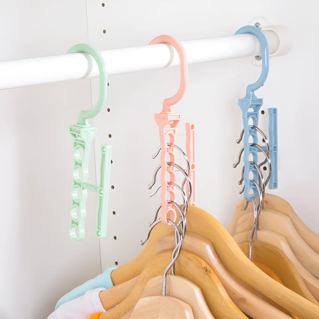 Blue revolving wardrobe hanger with five branches and a central handle for organising clothes.