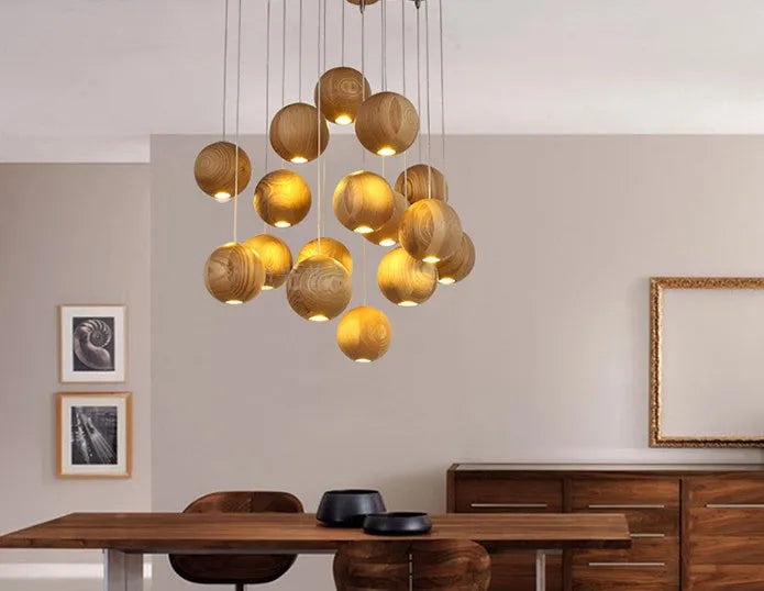 Nordic style solid wood ball chandelier with wooden spheres hanging from a wood disc ceiling plate.