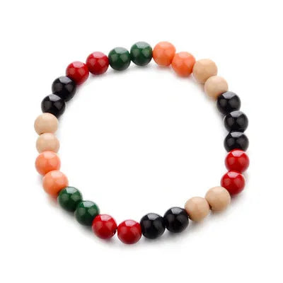 Unisex ethnic-style beaded bracelet made from natural lava stone on a wrist.