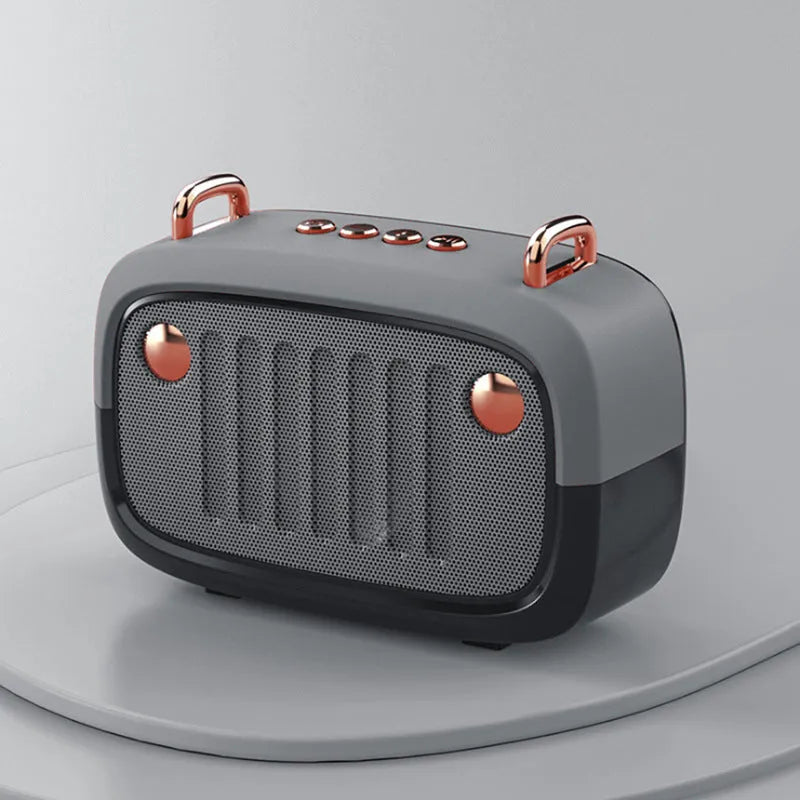 Small black portable Bluetooth speaker with USB port on a plastic and ABS cabinet.
