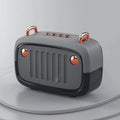 Small black portable Bluetooth speaker with USB port on a plastic and ABS cabinet.