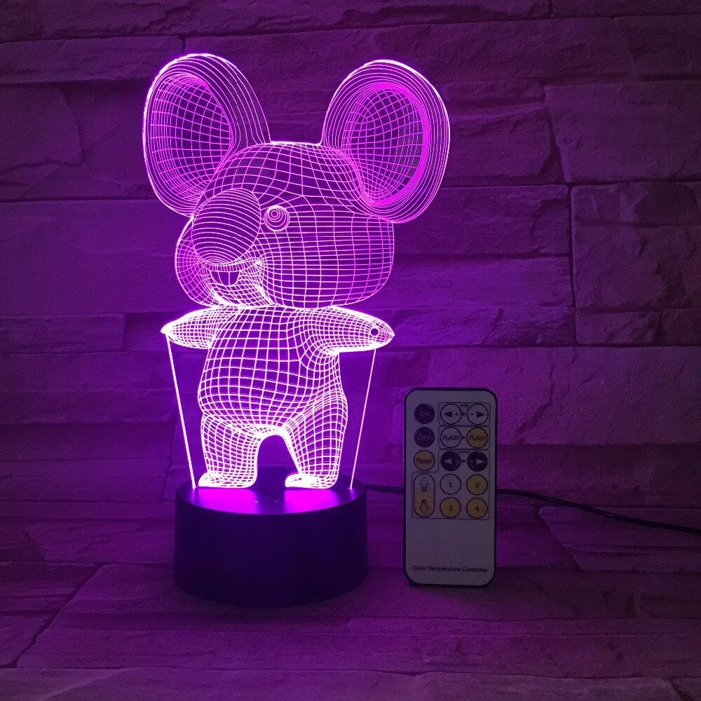 Black koala-shaped LED night light on a table showing multi-colour glow option.