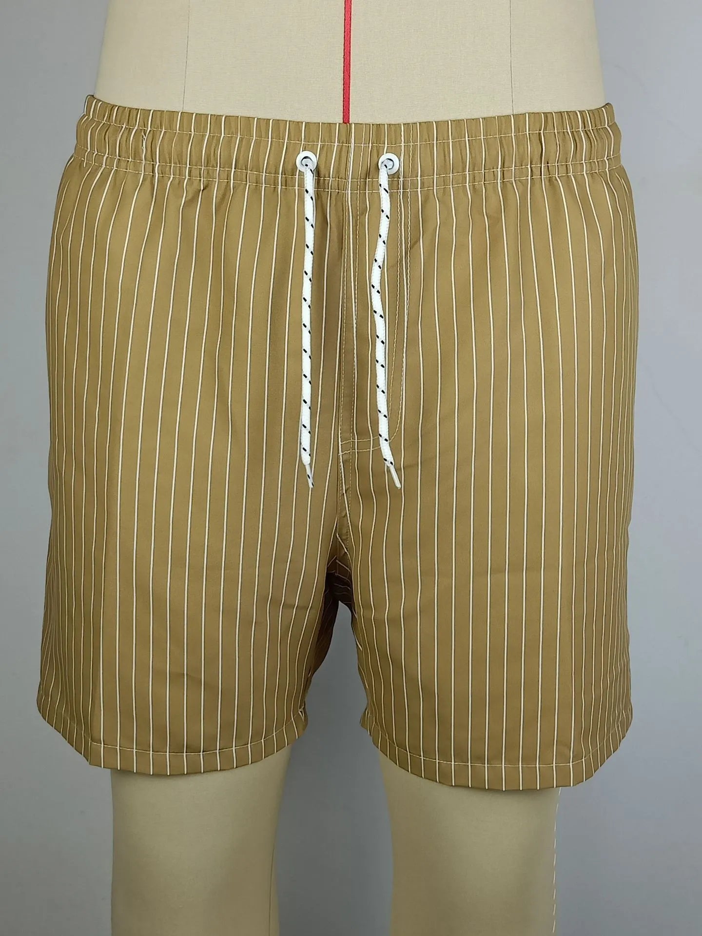 Polyester fibre striped beach shorts with straight leg opening and triangle lining design in multiple colours
