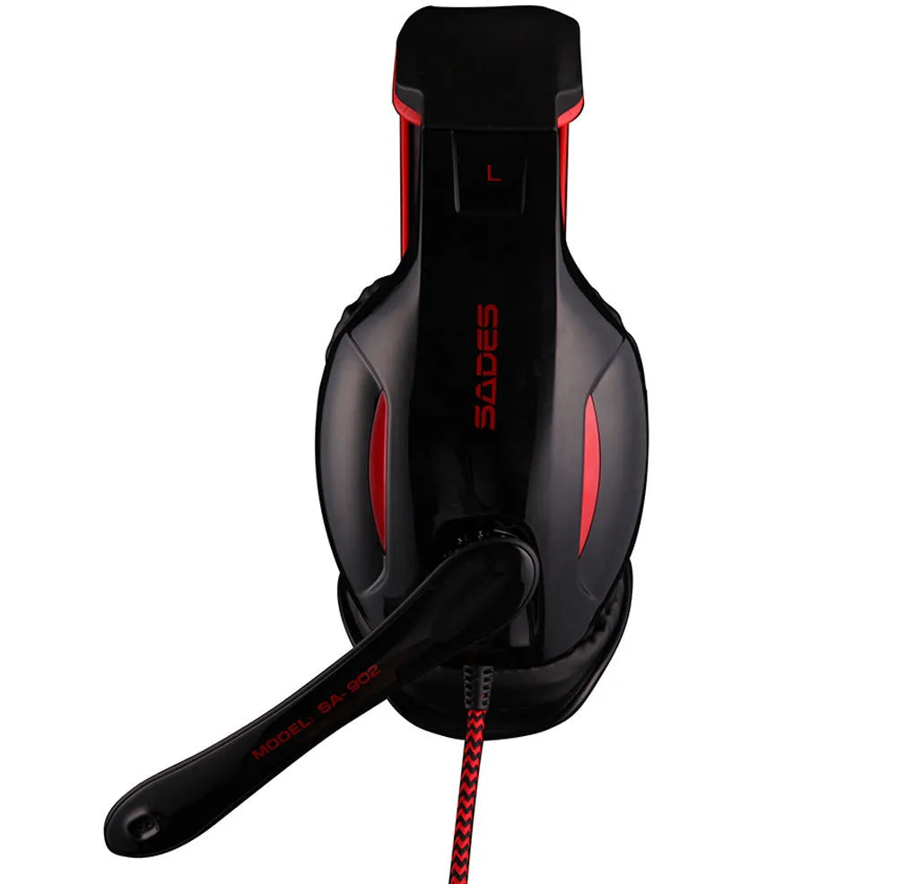 Black SADES SA902 wired USB gaming headset with over-ear cups on a desk.