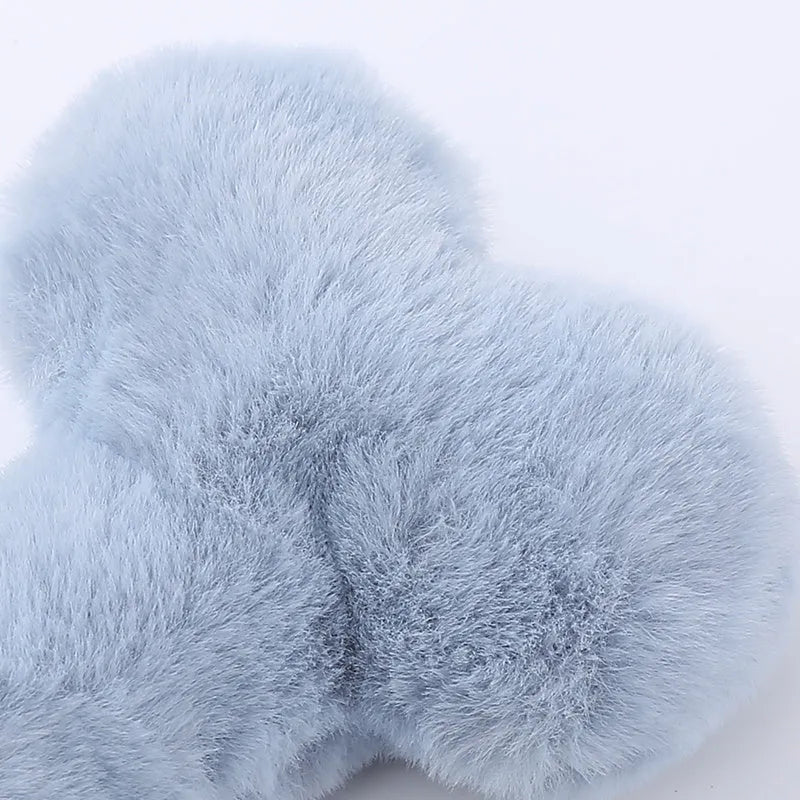 Blue plush bone-shaped dog toy with a squeaker for interactive bite-resistant play