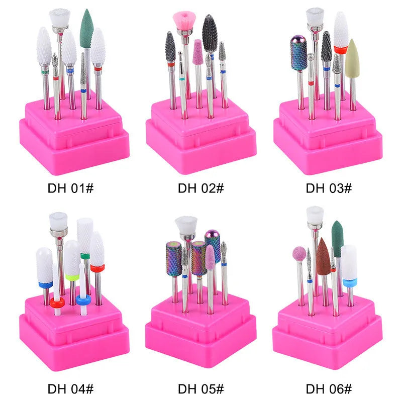 Set of seven tungsten steel nail drill bits and a brush in a transparent plastic storage case.