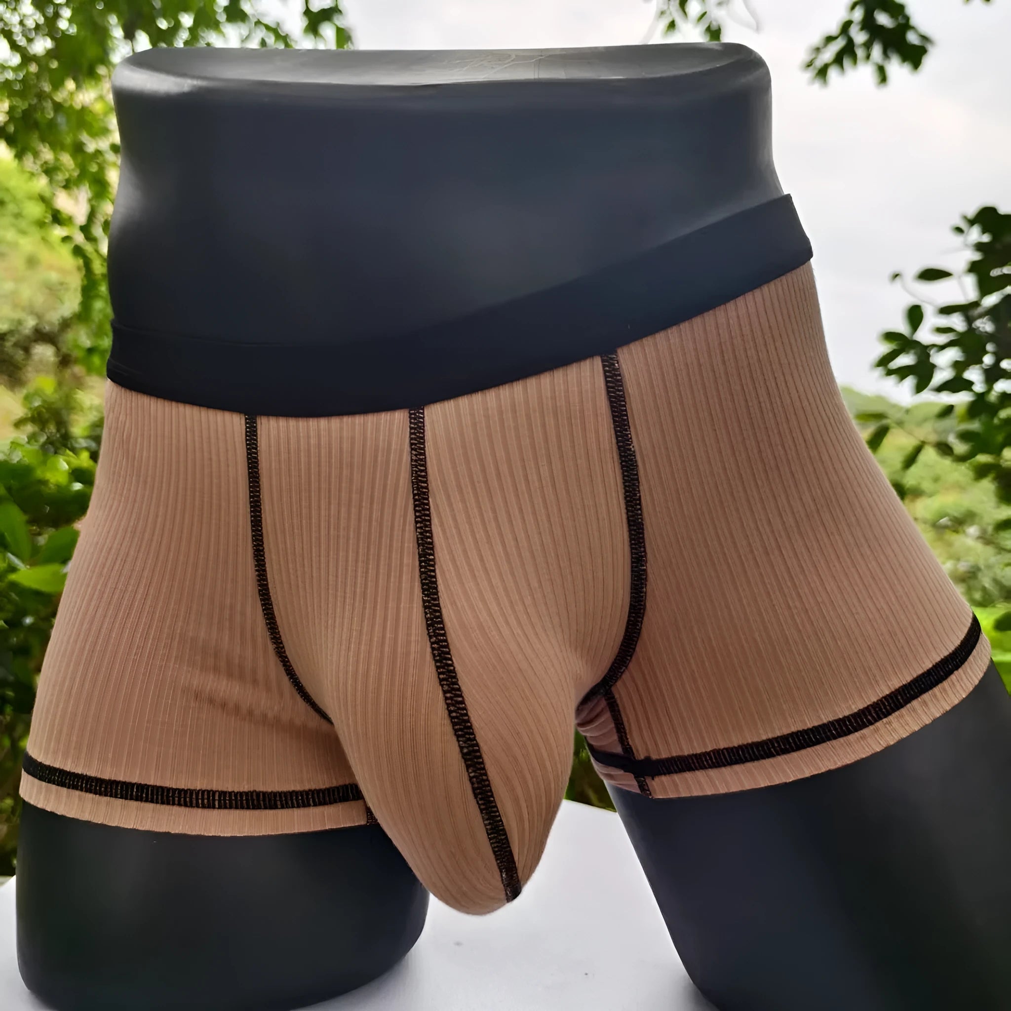 Men's slim-fit breathable boxer shorts in solid colours, shown in size range L to 3XL.