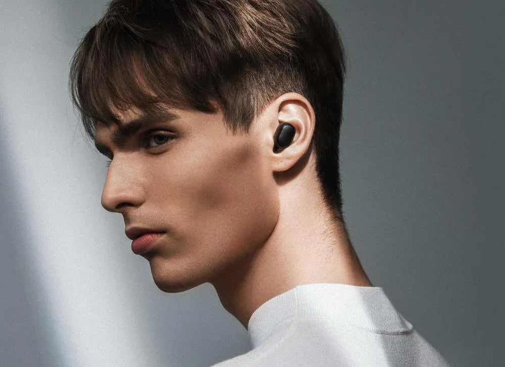 Redmi AirDots 2 Black true wireless earphones with their compact charging case.