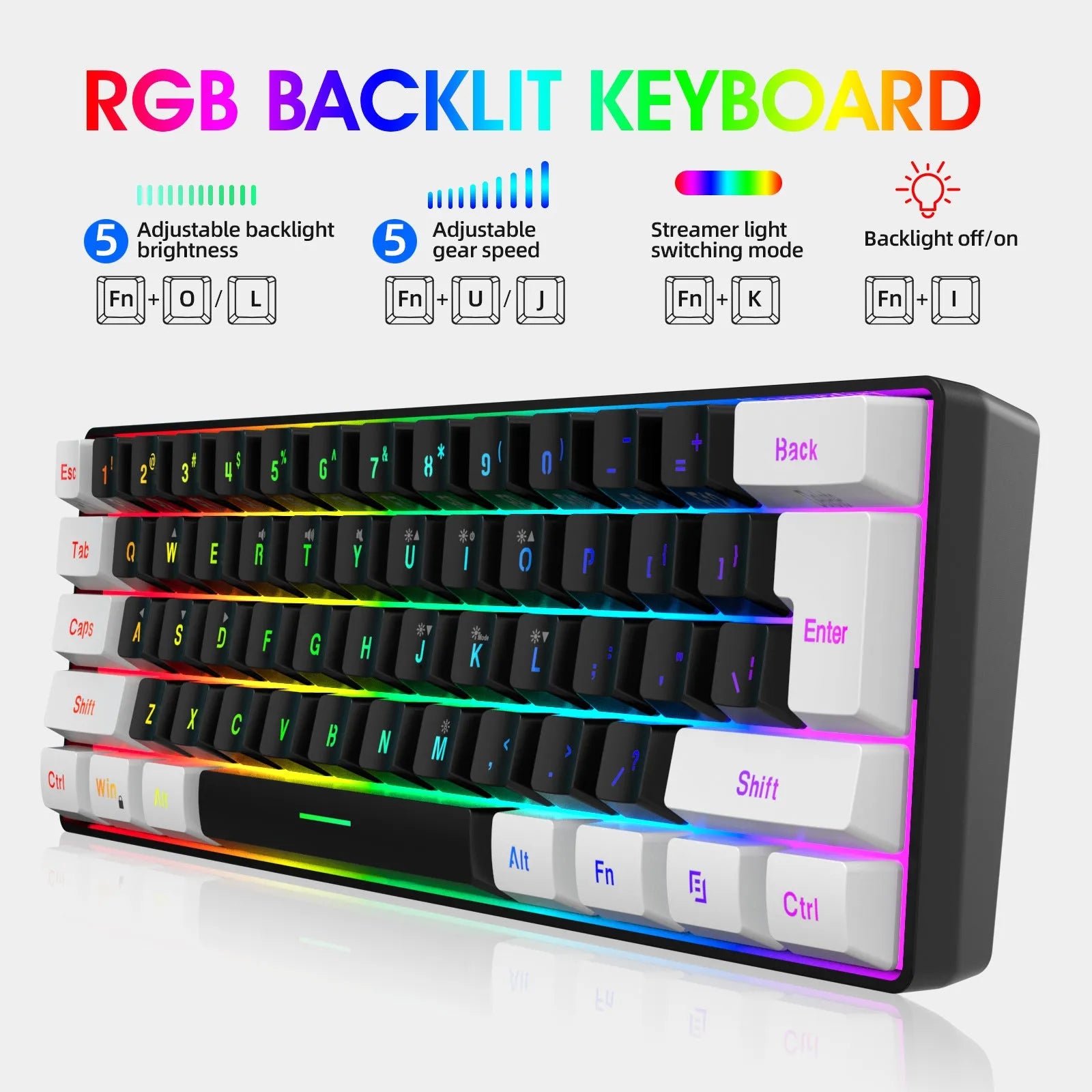 White and black gaming keyboard and mouse set with colour backlight on desk beside notebook computer