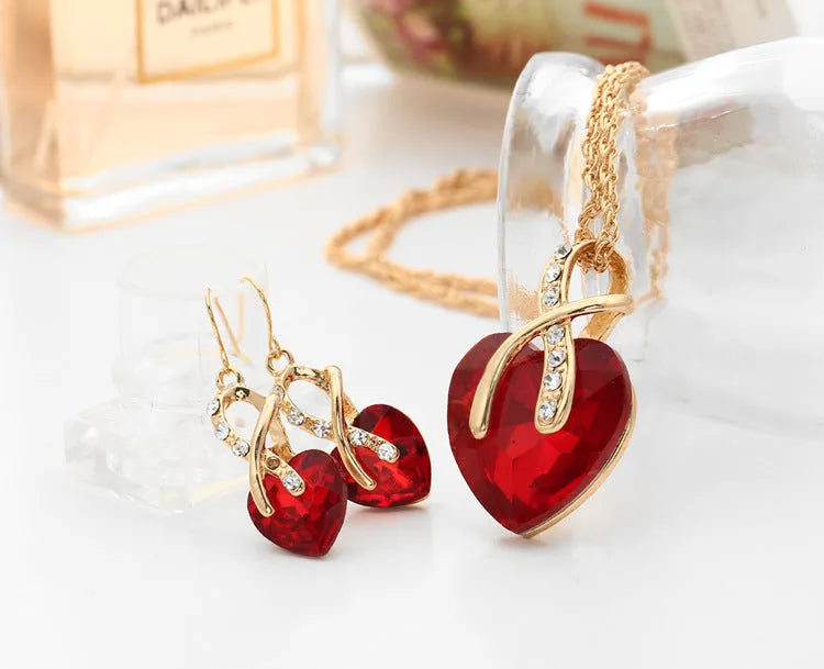 Heart shaped faux Austrian crystal zircon earrings with water wave chain in alloy, red colour option