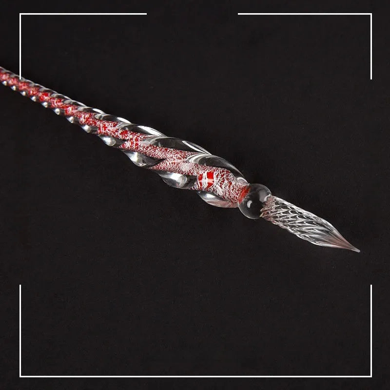 Transparent glass art pen with coloured ink dipped design in a gift box.
