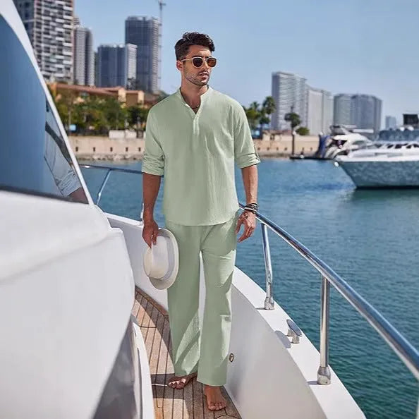 Men's solid colour cotton suit with long sleeve top and trousers in beige, shown laid flat