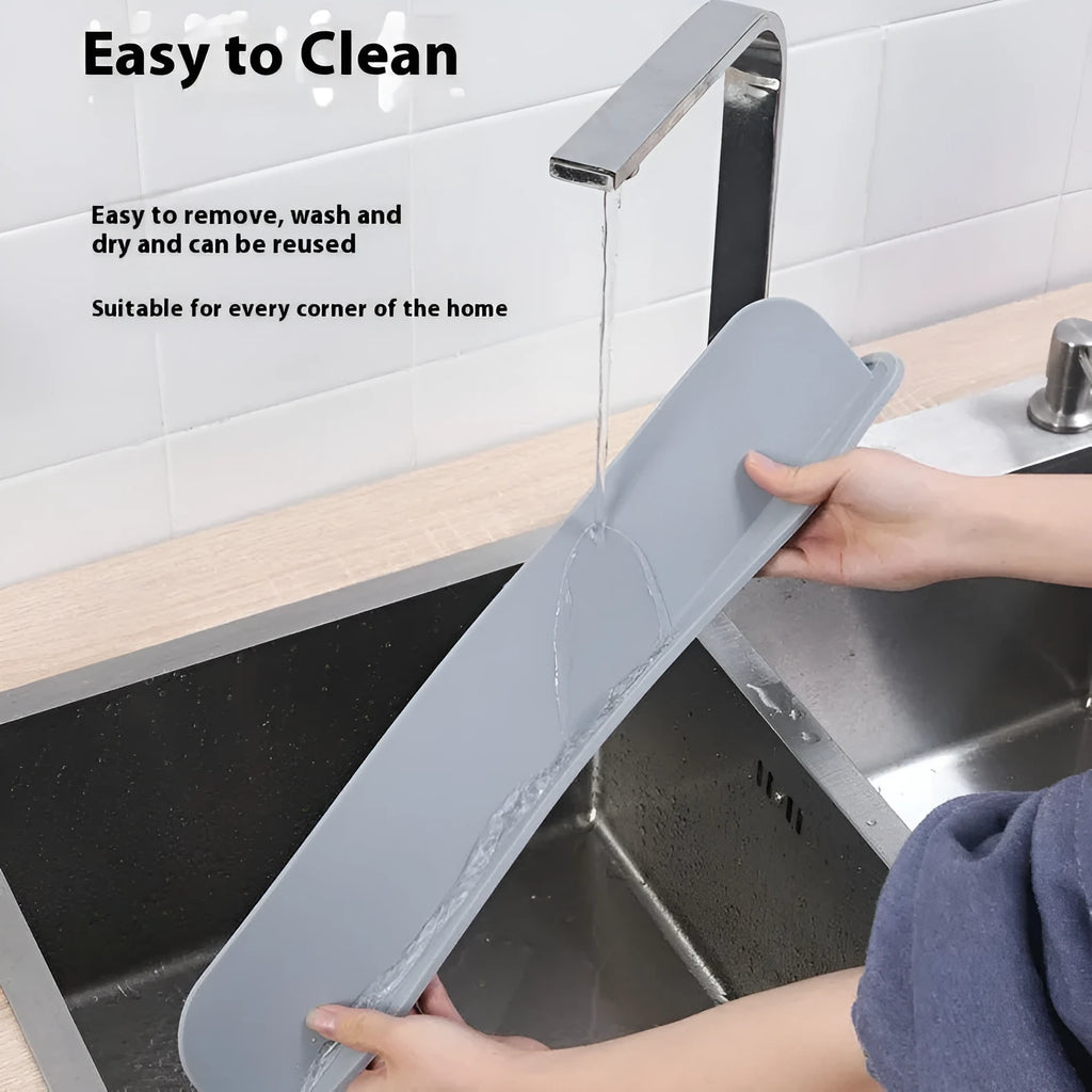 Thick grey blue silicone sink water blocking plate measuring 52mm by 85mm.