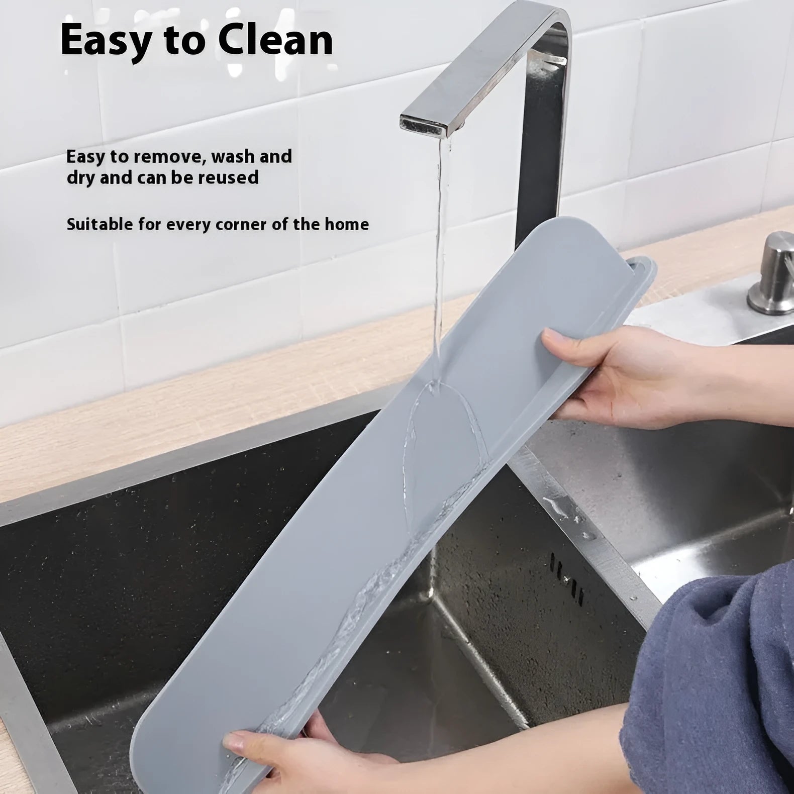 Thick grey blue silicone sink water blocking plate measuring 52mm by 85mm.