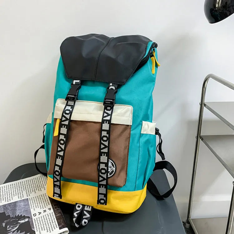 Oxford cloth backpack in black, green, or red with handheld grip and shoulder straps.