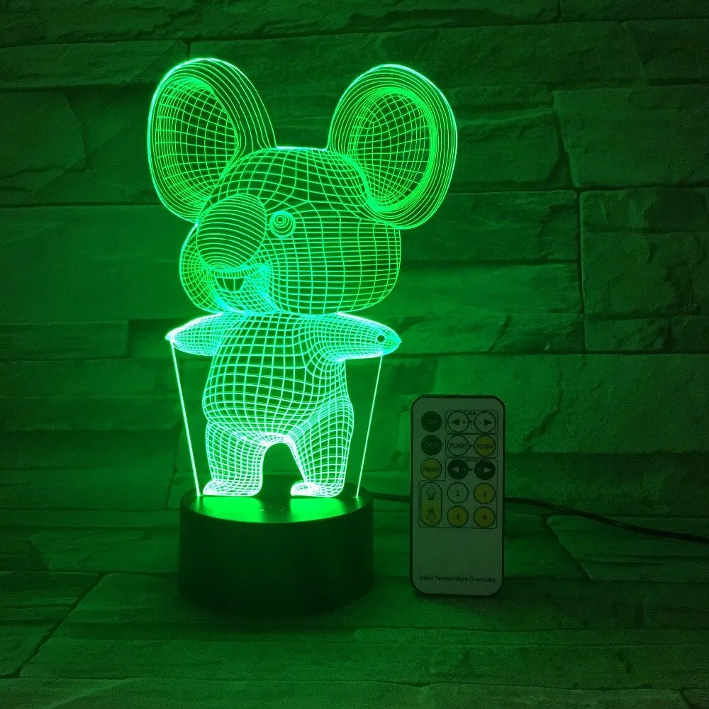 Black koala-shaped LED night light on a table showing multi-colour glow option.