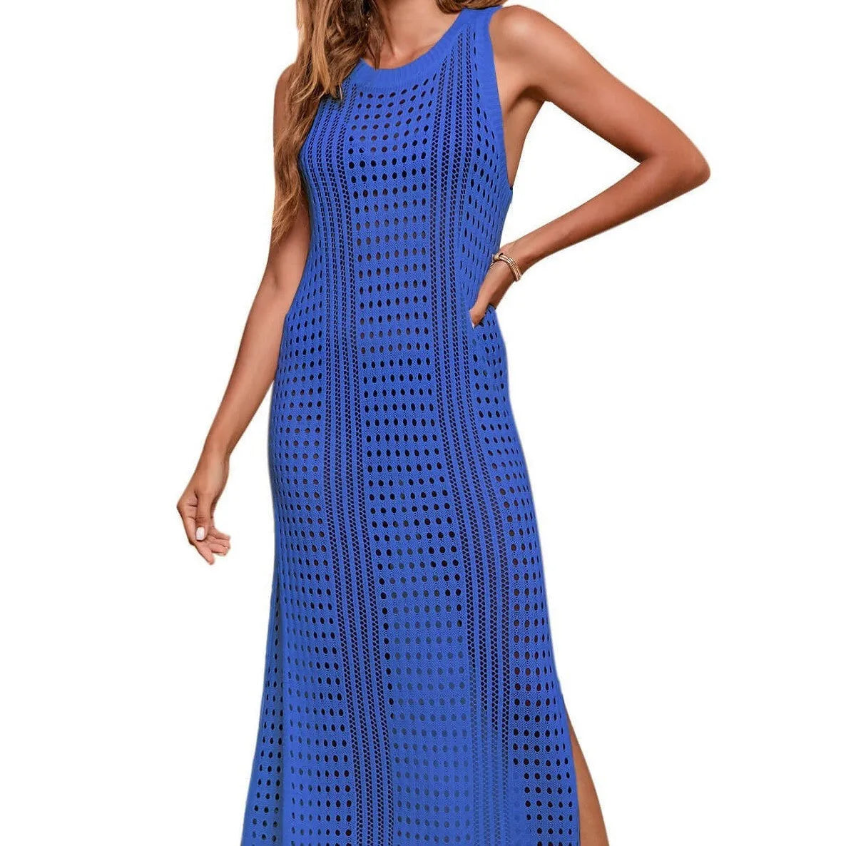 Long loose women's beach blouse in hollow-out knit, shown in a solid colour, laid flat.