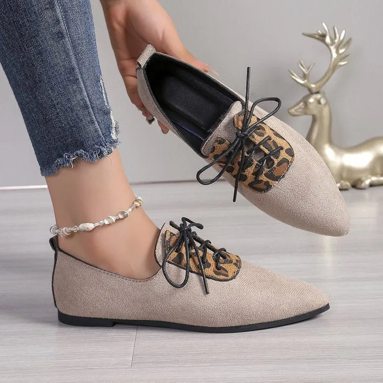 Beige leopard print pointed toe pumps for women with a block heel, shown in a plus size.