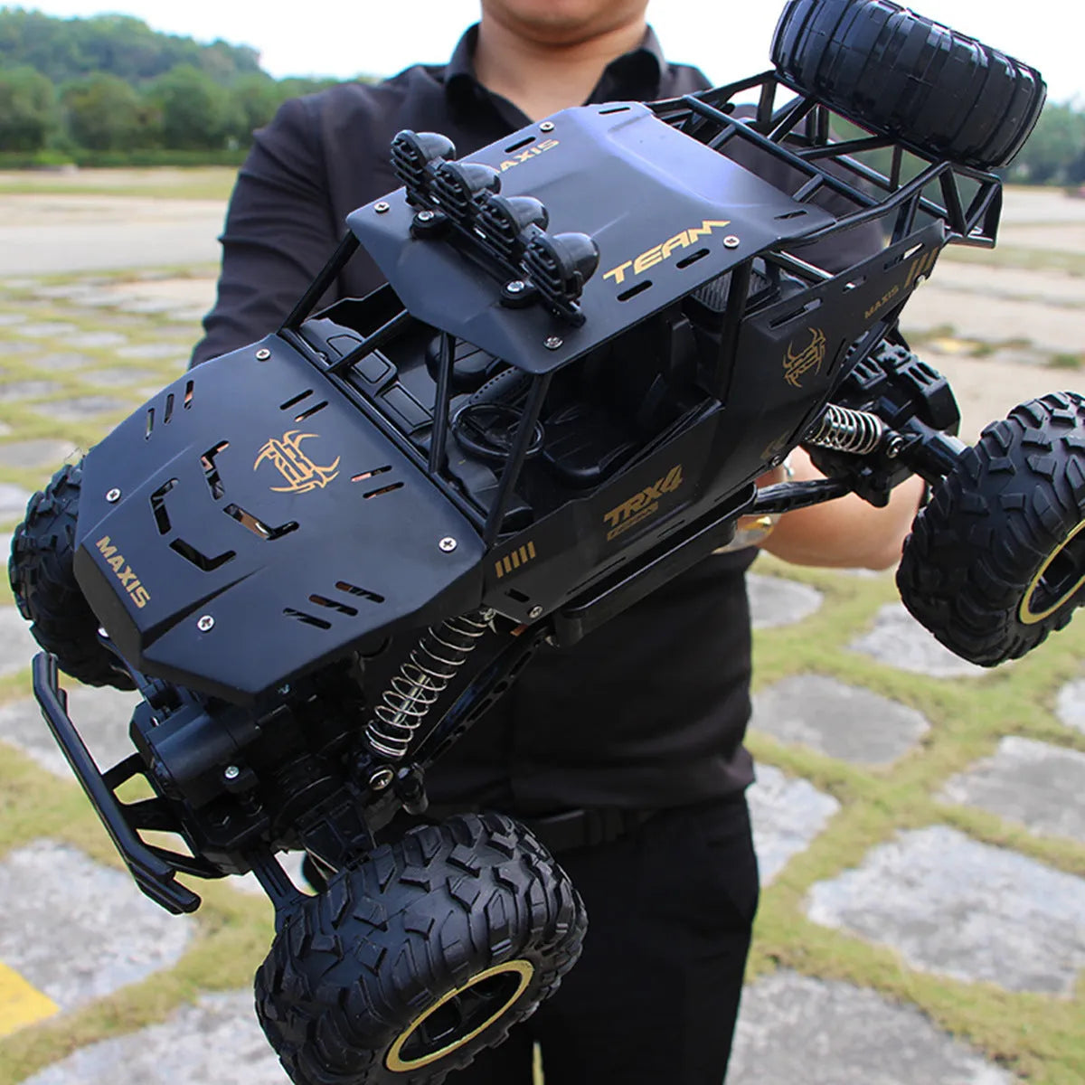 Black and silver 4WD remote control off-road climbing car with 2.4G wireless controller