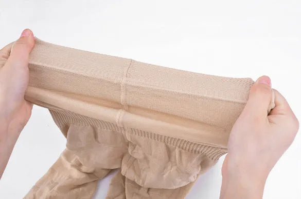 Women's seamless high-waist shapewear shorts in black and nude colours on a mannequin