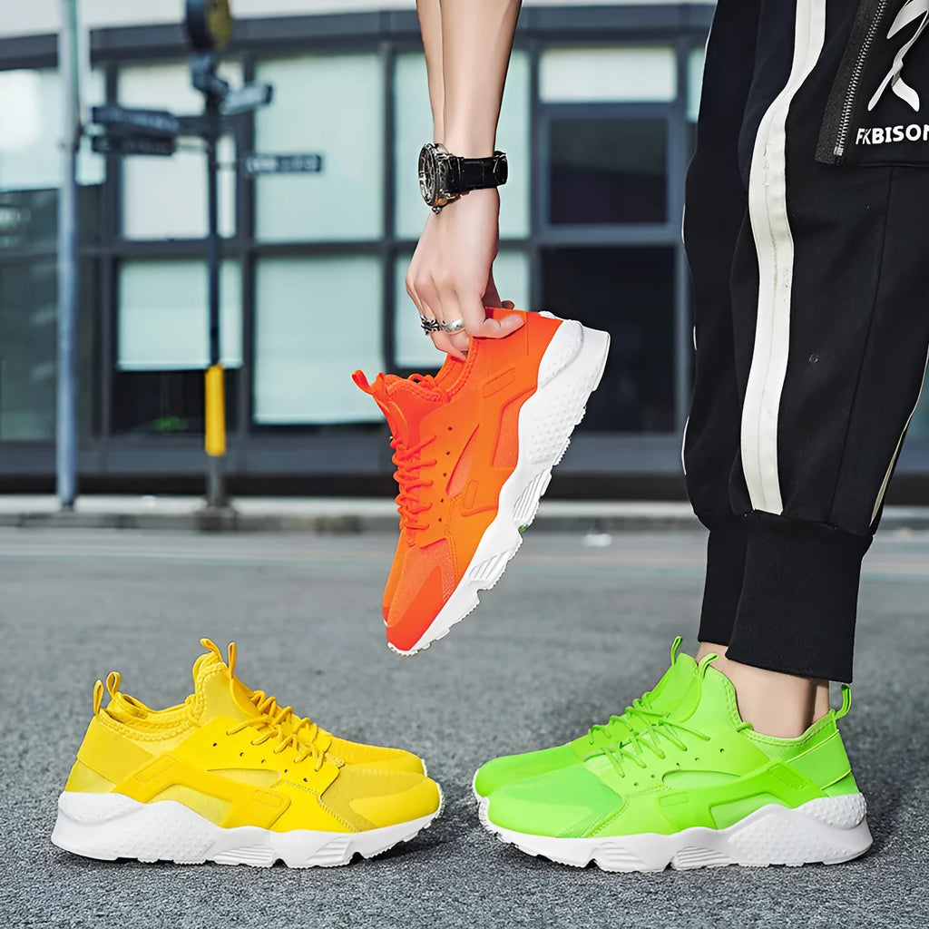 Men's low top casual shoes in fluorescent red with mesh upper, cross shoulder straps, and flat MD sole.