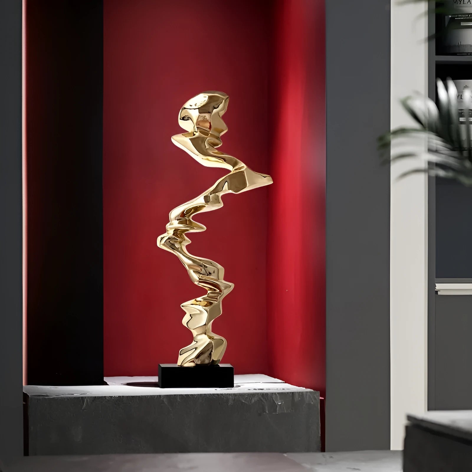 Modern abstract decorative ornament made from natural resin in a choice of gold, silver, or blue.