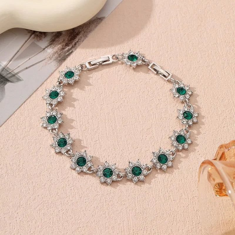 Zinc alloy flower bracelet with electroplated colour finish and colourful crystal decorations in gold and silver variations