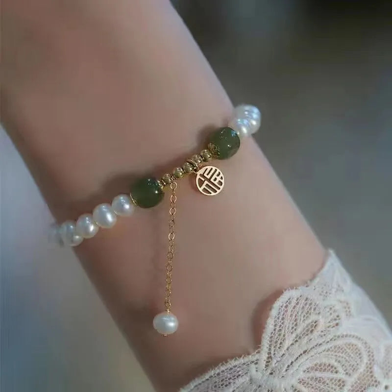 Handmade Chinese style glass bracelet with bamboo joint beads in a red Lvzhu Duobao design.
