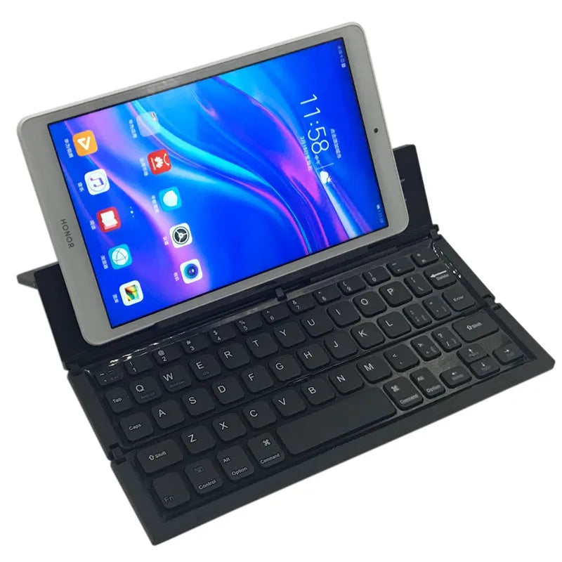 Black foldable Bluetooth keyboard shown alongside tablet demonstrating portable design