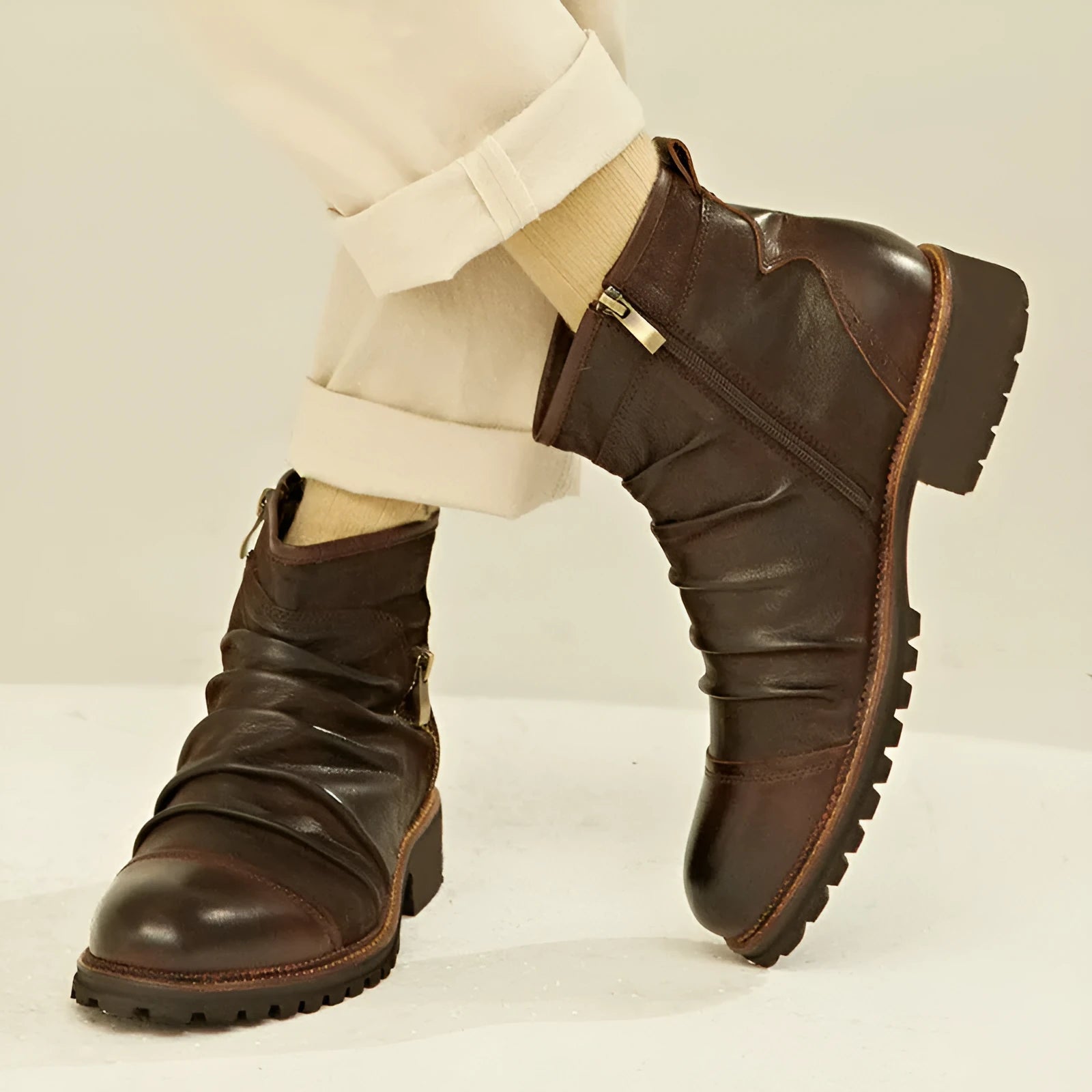 Men's black side-zip cowboy boots with a mid-calf shaft and horseshoe heel on a plain background