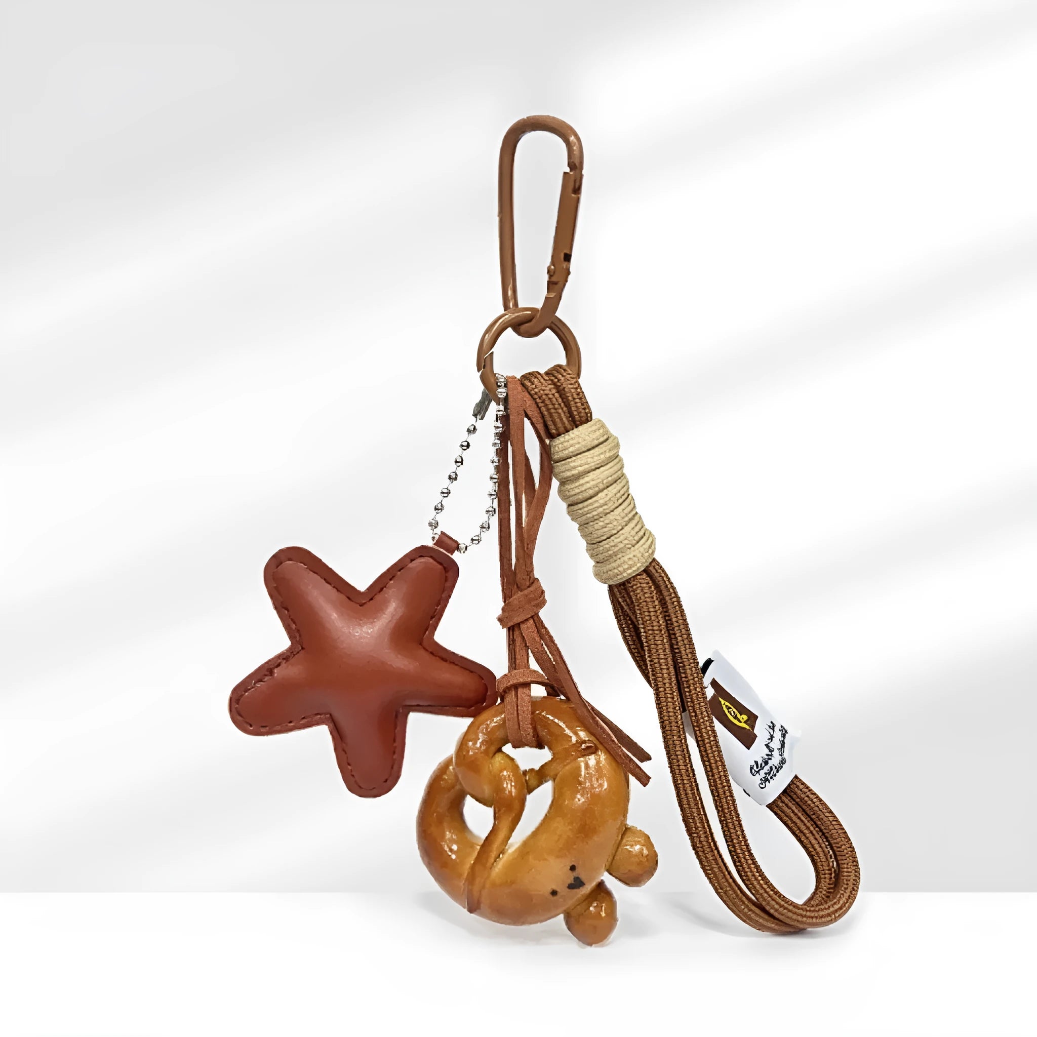 Handmade soda bread style handbag pendant charm with cartoon design and brown strap