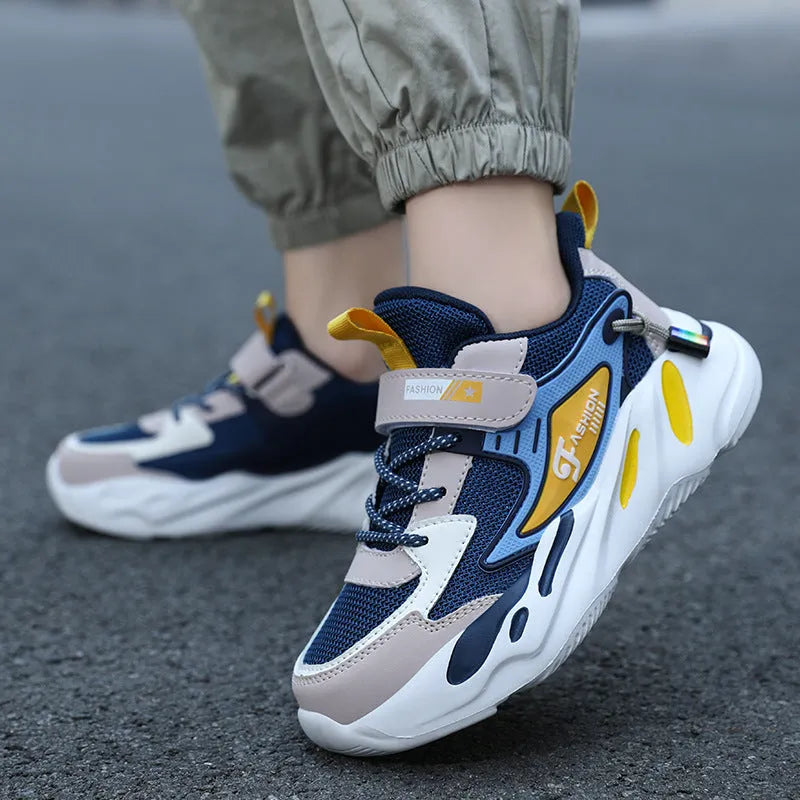 Boy's dark blue and black Velcro-fastened platform sports running shoes with breathable mesh upper.