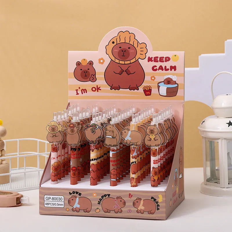 Box of 48 cartoon bear acrylic paster gel pens with black ink on a white background.